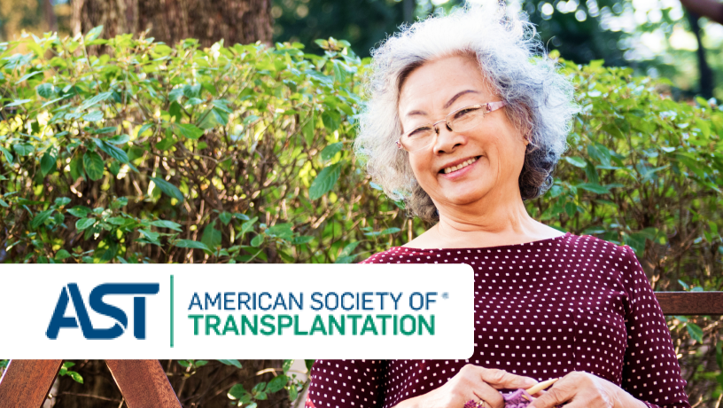 An elderly woman seated outdoors on a wooden bench, wearing a maroon polka-dot top, with green foliage in the background, and the “AST AMERICAN SOCIETY OF TRANSPLANTATION® ” logo visible in the image.